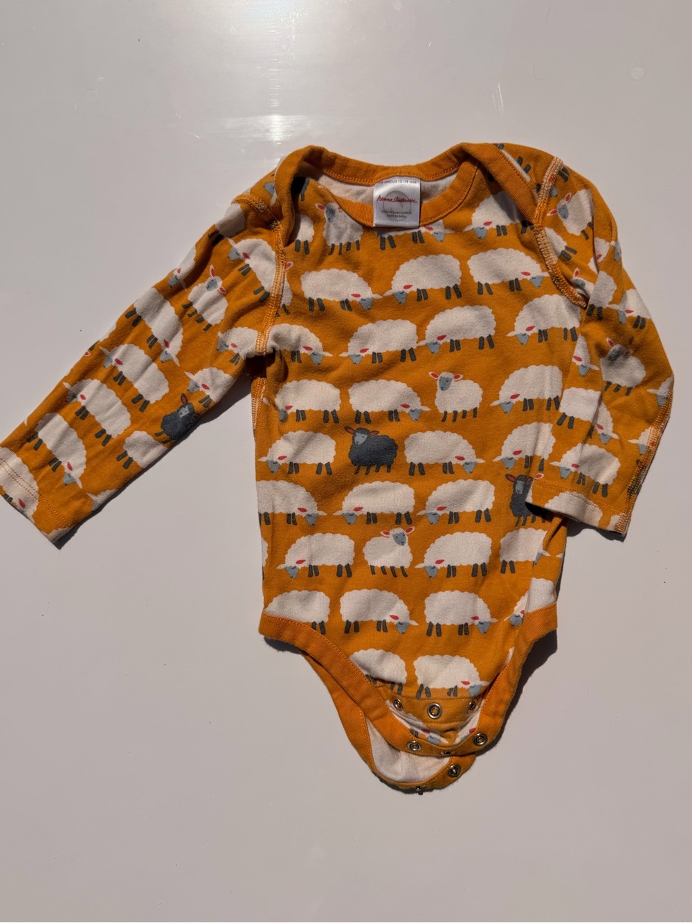 Hanna Andersson Yellow Black Sheep Print Long-Sleeve Baby Onesie